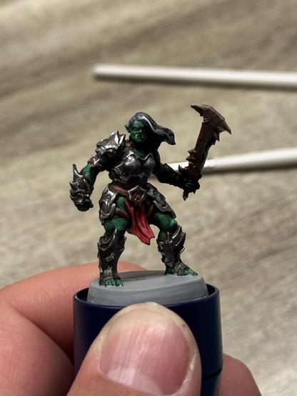 The orc warrior of heroquest. It is shown from the front after a little more highlights were added to it. I added a white strand of hair to her. It is a work in progress.