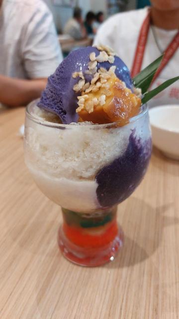 Halo-halo, a Filipino crushed ice dessert containing ube ice cream, flan, candied fruits and jello.