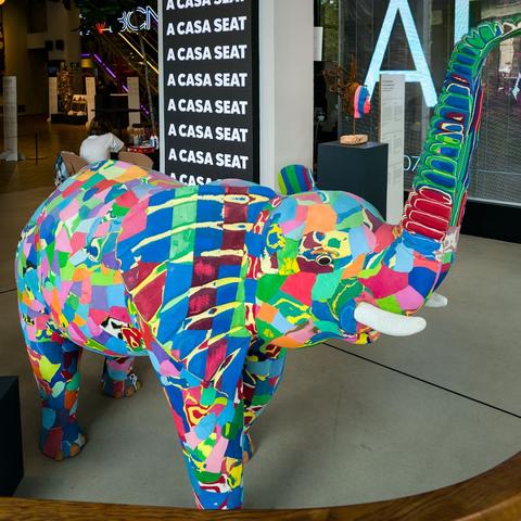 A colourful piece of art representing an elephant.