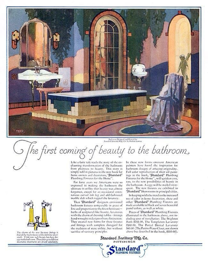 A beautiful bathroom with colorful tile and white fixtures is seen. There’s a chair with a bathrobe thrown over the back.