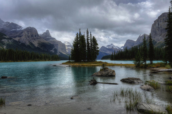 Maligne Lake Spirit Island Jasper National Park Alberta Canada

Spirit Island is a renowned and breathtakingly beautiful location situated on Maligne Lake in Jasper National Park, Alberta, Canada. This tiny, picturesque island is surrounded by the towering peaks of the Canadian Rockies, with pristine turquoise waters reflecting the stunning scenery.

The name "Spirit Island" originates from the Indigenous peoples of the area, who believe that the island is inhabited by spirits. It has become an iconic symbol of the Canadian wilderness and is one of the most photographed locations in the country.

Visitors typically reach Spirit Island by taking a boat tour on Maligne Lake, which is the largest natural lake in the Canadian Rockies. The journey to Spirit Island offers panoramic views of the surrounding mountains and glaciers, making it a memorable experience for nature enthusiasts and photographers alike.

The beauty and tranquility of Spirit Island make it a must-see destination for anyone exploring Jasper National Park and the Canadian Rockies.

Image:
https://fineartamerica.com/featured/maligne-lake-spirit-island-jasper-national-park-alberta-canada-wayne-moran.html

Read more: 
https://waynemoranphotography.com/blog/10-beautiful-places-see-photograph-jasper-alberta-canada/

#Canada #Jasper #NationalPark #mountains #Landscape #photography #travel #travelphotography

#AYearForArt #buyintoArt