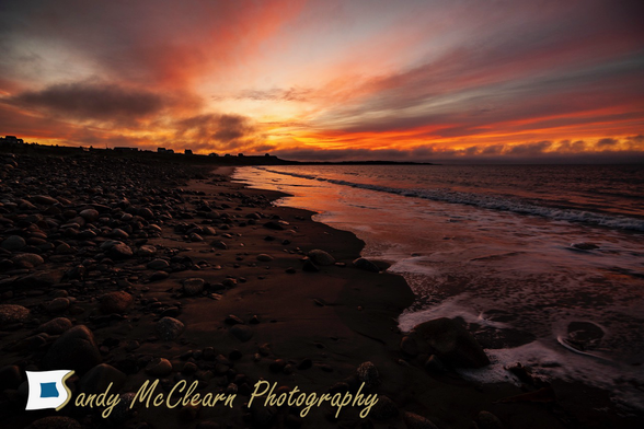 Orange sky at dawn at the beach.