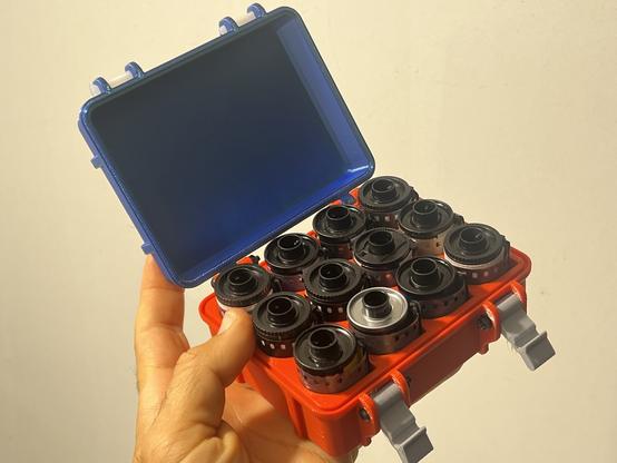 The box open to show 12 rolls of 35mm film.