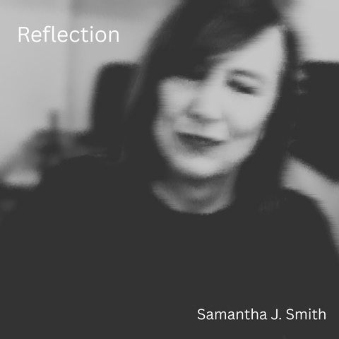 A black and white grainy picture of Samantha with a small smile on her face, head tilted to one side. The title, Reflection, is in white in the top left-hand corner