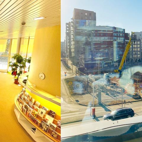 Bright library interior with yellow accents and bookshelves on the left; urban construction site with a crane under clear skies on the right.