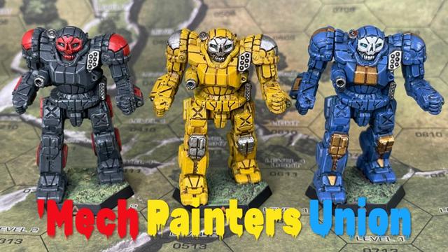 Three Atlas miniatures with 'Mech Painters Union text