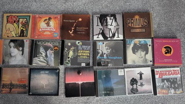 A photo of CDs on a floor with these being by the following :
BEAK>, Amadou & Maria, Kronos Quartet, Arianne Moffat, Primus
Souad Massive, Moondog, Julie London, Sarah Vaughan, Julie London, Trojan Singles Box Set
Roy Irbison, Arvo Part, Mogwai, Mogwai, Hackedpicciotto, The Women's Choir of Sofia