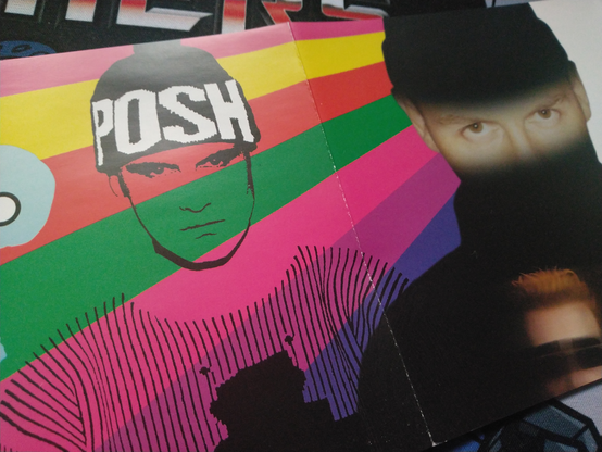 A small portion of the included 16-page fold-out booklet, which is really more of an extended mural containing images representing different eras of the band's career.