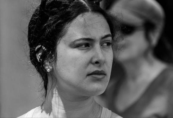 A candid black & white photo of a woman for my series called "Faces In A Crowd".
