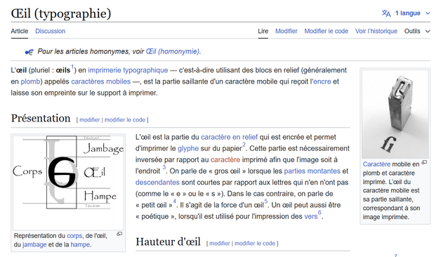 Capture d'écran de l'article Wikipédia sur "L’œil" typographique. L'image montre une explication détaillée de la partie saillante d'un caractère mobile, appelée l’œil, qui reçoit l'encre et imprime sur un support. On y trouve des illustrations présentant les différentes parties d'un caractère typographique ainsi que des exemples photographiques de caractères mobiles et leurs empreintes.