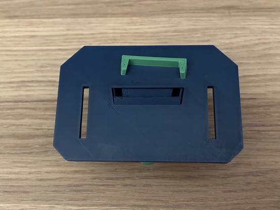 Back side of the unit.  The tray has been slid into place, and the clip is ready to be pushed in.