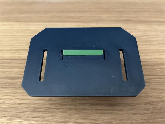 Back side of the unit, fully assembled.  The back edges of the tray, clip, and base plate are flush.