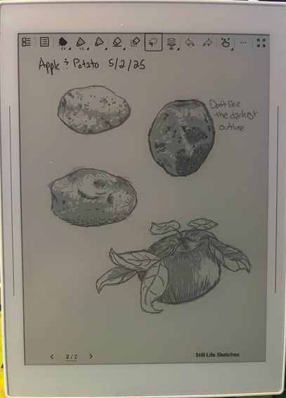 A photo of a supernote with black and white digital sketchs of 3 potatos and an apple, noted 5/2/25