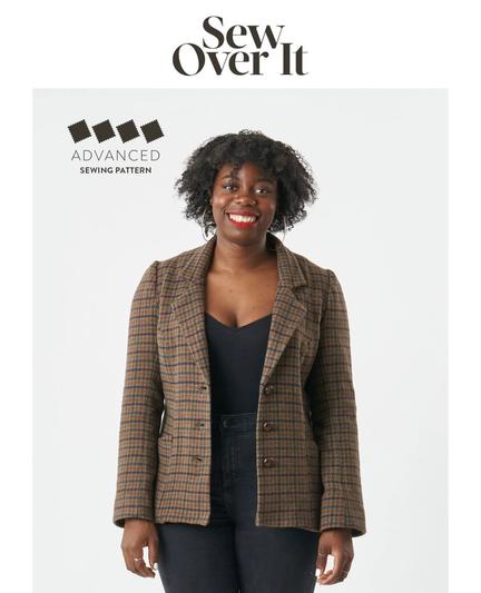 A model in a single breasted tweed blazer with three buttons.