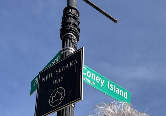 The Neil Sedaka Way sign, on Brighton Beach. It shares a post with the Coney Island street sign.