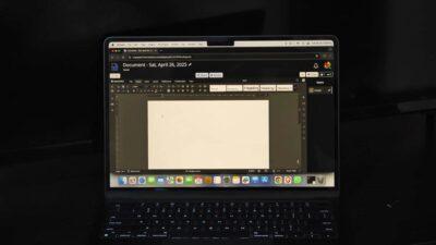 Close-up of a laptop screen displaying a blank document titled "Document - Sat, April 26, 2025" with formatting options visible.