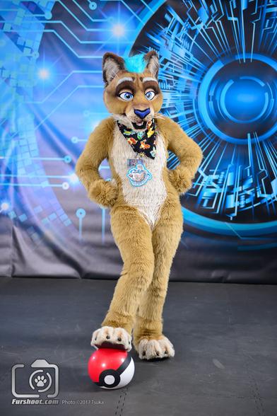 Lioness fursuiter posing with Pokeball