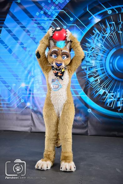 Lioness fursuiter posing with Pokeball