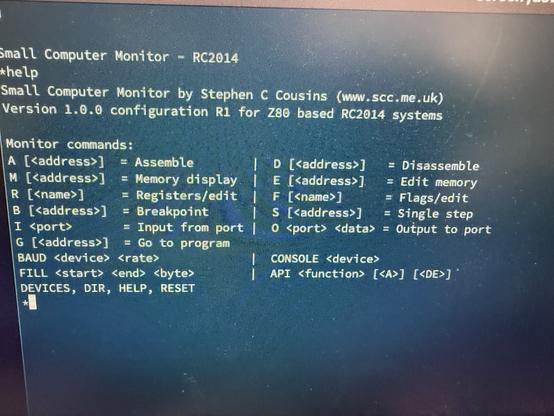 Output from the serial port of the Mini II. The screen shows the Small Computer Monitor (SCM) prompt as well as the output of the help command.