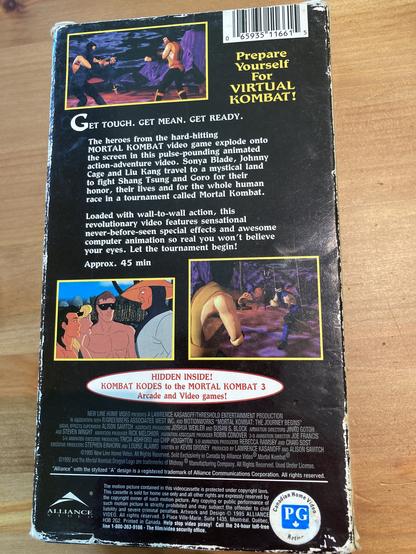 The back cover of the mortal kombat cartoon. 

The copy reads: Prepare yourself for virtual kombat!

Get tough. get Mean. Get Ready.

Loaded with wall-to-wall action, this revolutionary video features sensational never-seen-before special effects and awesome computer animation so real you won't believe your eyes. Let the tournament begin. 

It has three truly terrible screenshots, each in a completely different style. Top: very bad 3D CGI.
Left: very bad hand drawn animation cels. Right: even worse 3d CGI.