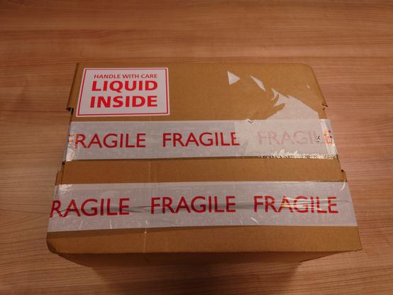 Parcel marked "Fragile" and "Liquid Inside" as thats what it contains