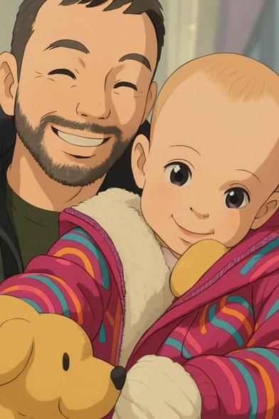 Father and toddler hugging and smiling