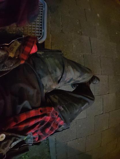A top-down view of me sitting at a bus stop