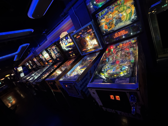A line of vintage pinball machines