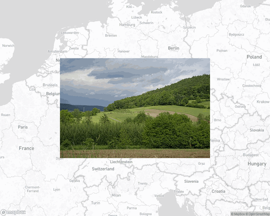 A photo of or from a park from the linked website, overlaid on a cropped world map where it's located.
