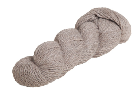 Product photo of a hank of yarn, twisted as expected. It's a pale tan color, a natural color of the hair of the alpaca from which it is harvested. White background.