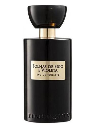 Frasco do perfume Folhas de Figo e Violeta Eau de Toilette. Frasco preto com detalhes dourados. Fundo branco.
