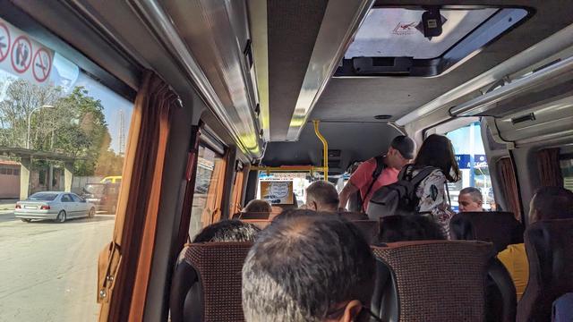 Interior of a packed mini bus.