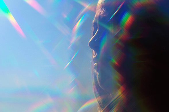A closeup of a woman enjoyin sunshine