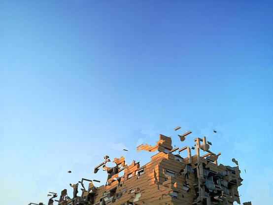 Deconstruction of a building over a blue sky