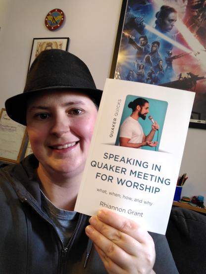I'm holding up a copy of the book with a big smile.