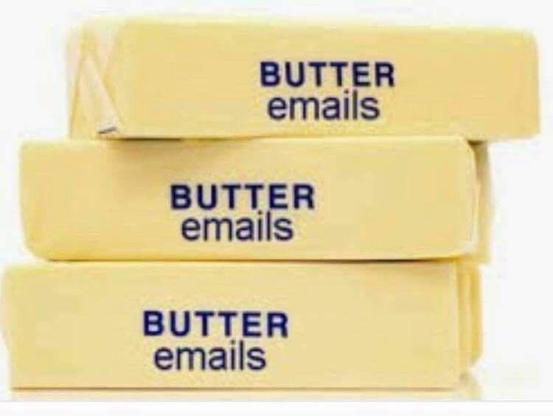 An image of the stacked sticks? wads? of butter wrapped in paper labelled with "BUTTER emails". The background is plain white.
