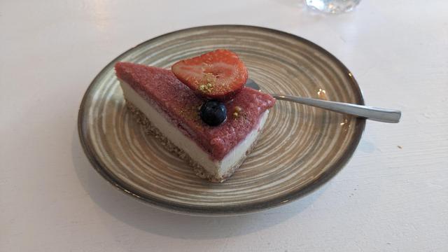 A plate with strawberry cake.