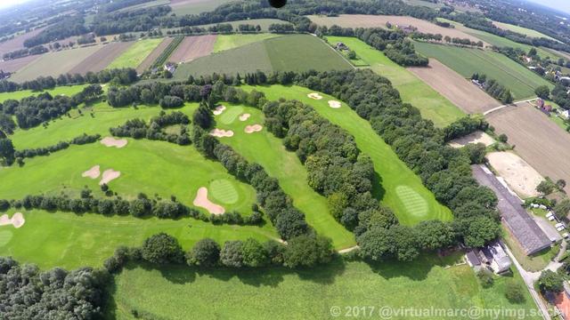 A photo of a GoPro Hero 4 Black camera mounted below the Gyrocopter. You can see a Golf course that is near the airport in Marl.