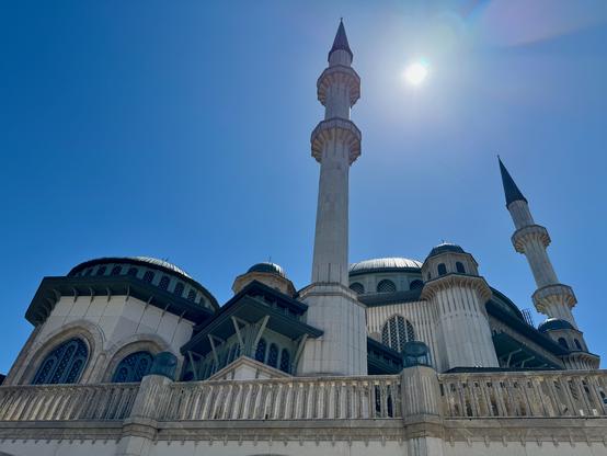a minaret against bright blue sky