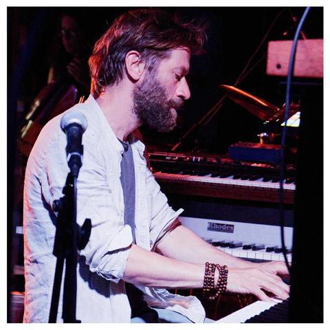 Benji Bower at the piano & surrounded by various electronicals during the first concert at the village hall.