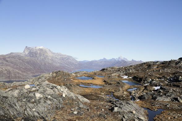 mountain range and fjord in greenland