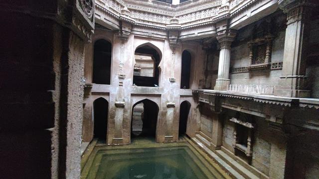 A structure with green colored water enclosed within.