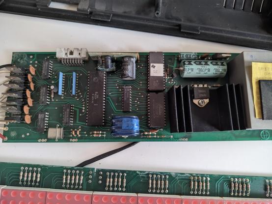 picture of the bottom board, containing some big ICs, MOSFETs and a transformer core