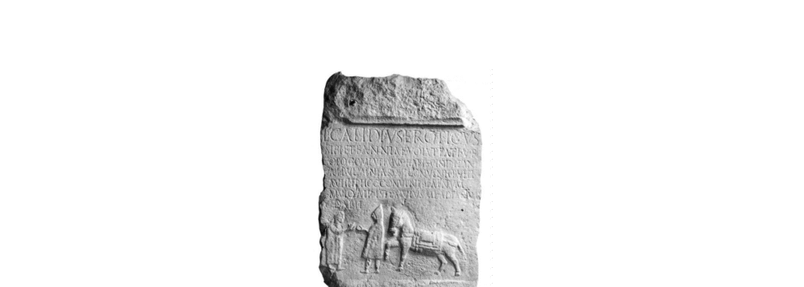 black and white photo of a slab with a Latin inscription and a relief of a man, a man in a hooded cloak, and a saddled mule