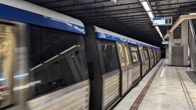 A subway entering a station.