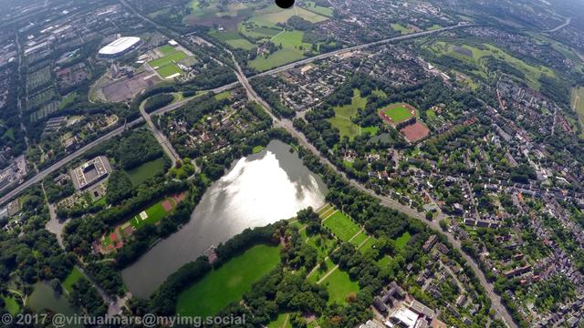 An aerial photo of Gelsenkirchen Buer. With the Berger Lake in the front. The Veltins Arena can be seen at the top left.