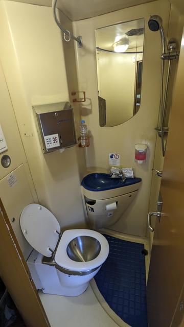 A toilet and shower combination in a CFR night train.
