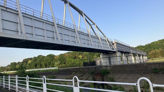 The big water supply pipe bridge across the bike path and the river.