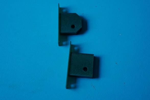 Two 3d prints. One with its corners removed and parts of its geometry slightly shifted about.