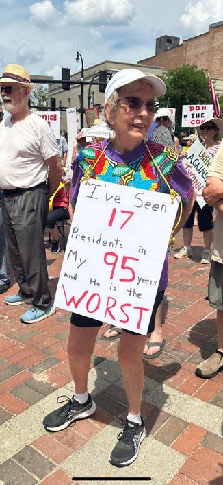 95 year old lady protesting trump with her sign
